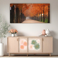 Large panoramic autumn forest canvas wall art in wide format, displayed above a wooden sideboard. Oversized long canvas wall decor for living room or dining room.
